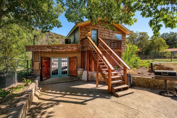 Riverfront Group Retreat | Hot Tub + Billiards | Sleeps 14 | Guadalupe River - Image 1